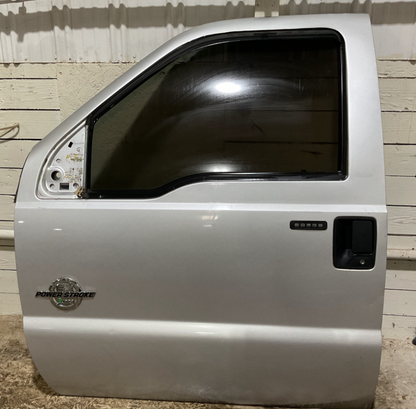 2011-2016 Ford F-250-F-550 Super Duty Front Driver Door Color: UX(Ingot Silver Metallic) USED OEM