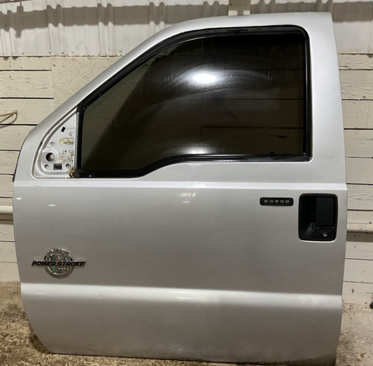 2011-2016 Ford F-250-F-550 Super Duty Front Driver Door Color: UX(Ingot Silver Metallic) USED OEM